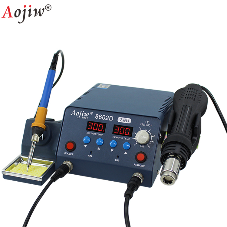 Hình ảnh tổng quan Máy khò, hàn AOJIW 8602D với tay hàn và tay khò.